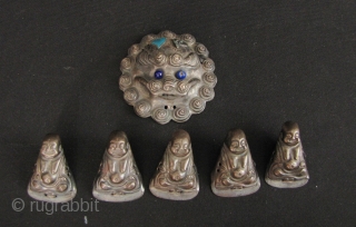 Happy Buddhas: Set of Qing Dynasty silver repoussé Chinese child’s hat ornaments. Very sweet little collection of 5 Budai and a lions face. Budai H: 2.9cm/1.1in and W: 2cm/0.8in and lion face  ...