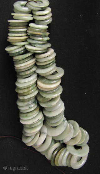 100 Jade Bi: One hundred antique perforated untreated Jadeite discs, circa 1880 to 1950. These were acquired from a Hong Kong jade dealer going out of business due to the ever increasing  ...