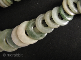 100 Jade Bi: One hundred antique perforated untreated Jadeite discs, circa 1880 to 1950. These were acquired from a Hong Kong jade dealer going out of business due to the ever increasing  ...