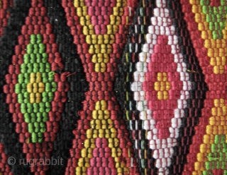 



Indonesia, Batak Ulos: Colorful hand woven beaded shoulder cloth from the Batak people, Sumatra. This piece is quiet lively and complicated with gold treads, and large “Rasta” colored diamond patterned warp embroidered  ...