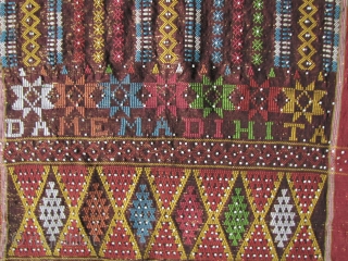 



Indonesia, Batak Ulos: Colorful hand woven beaded shoulder cloth from the Batak people, Sumatra. This piece is quiet lively and complicated with gold treads, and large “Rasta” colored diamond patterned warp embroidered  ...