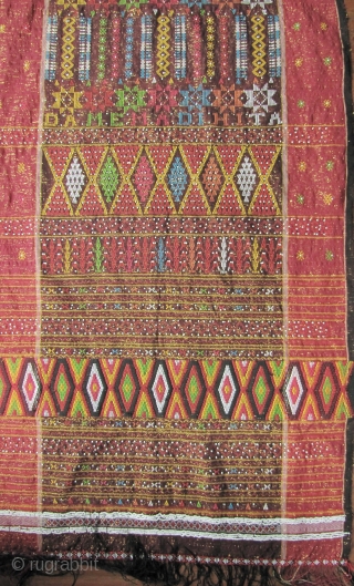 



Indonesia, Batak Ulos: Colorful hand woven beaded shoulder cloth from the Batak people, Sumatra. This piece is quiet lively and complicated with gold treads, and large “Rasta” colored diamond patterned warp embroidered  ...