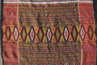 



Indonesia, Batak Ulos: Colorful hand woven beaded shoulder cloth from the Batak people, Sumatra. This piece is quiet lively and complicated with gold treads, and large “Rasta” colored diamond patterned warp embroidered  ...