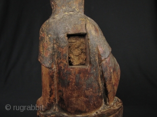 Qing Dynasty Guanyin: Lovely, circa 18th century wood statue of the Chinese Goddess of Mercy seated on a lotus leaf and buds.  There is one stem broken on the left bud  ...