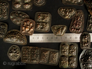 Buddhist Charms: Quirky and eclectic collection of 35 small repousse auspicious good luck tokens. These were collected in Dali, Yunnan, China in the late 1980s. No two are exactly alike and they  ...