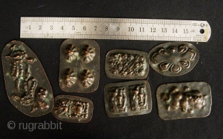 Buddhist Charms: Quirky and eclectic collection of 35 small repousse auspicious good luck tokens. These were collected in Dali, Yunnan, China in the late 1980s. No two are exactly alike and they  ...