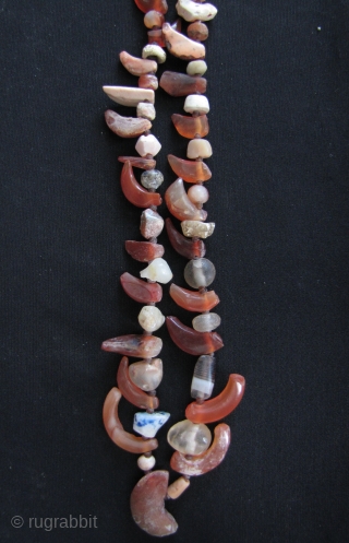 Two strands of Kushan/Bactrian of mixed stone (mostly carnelian) beads. I acquired these along with coins dating from 1st- 4th CE from the same site in Northwest Pakistan, so these can be  ...