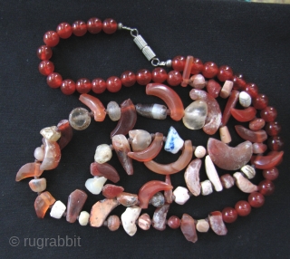 Two strands of Kushan/Bactrian of mixed stone (mostly carnelian) beads. I acquired these along with coins dating from 1st- 4th CE from the same site in Northwest Pakistan, so these can be  ...