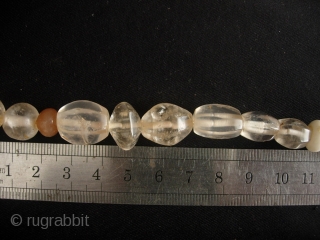 


South East Asian: Fine strand of quartz crystal beads (and a few carnelians) excavated from the Tak Burial site near Mae Sot along the Thai/Burmese border. These can be reliable dated to  ...