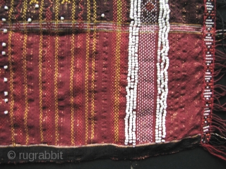 Colorful hand woven beaded shoulder cloth from the Batak people, Sumatra. This piece is quiet lively and complicated with gold treads, and large “Rasta” colored diamond patterned warp embroidered bands. The “Dame  ...
