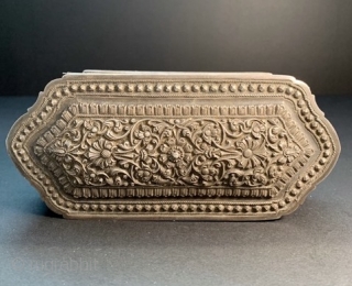 
Fine and elegant 19th century Sri Lanka repoussé and chased silver box. Excellent condition, except a few tiny dents on the bottom edges.  L: 14.2cm/5.6in x W: 4.2cm/1.6in x H: 6.2cm/2.4in.

http://www.abhayaasianantiques.com/items/1449233/Sri-Lanka-Silver-Trinket-Box

 