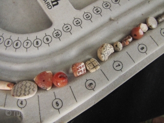 Etched Carnelian Beads: Loose strand lot of mixed etched and faceted beads from what is now Pakistan. I bought these along with a group of Bactrian and Kushan coins so these come  ...