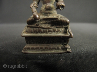 Small bronze image of Annapurna; the Goddess of the hearth and food (as well as a whacking big mountain named after her). She sits holding a ladle with which she feeds the  ...