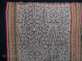 Iban woman’s kain skirt from Sarawak depicting the tree of life with bamboo running the length of the bidang. There is some fraying on the selvedge, and a seamless repair noted in  ...