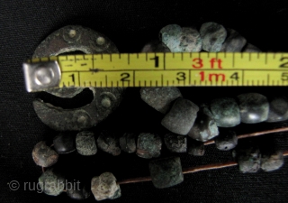 Ancient Shavaite Trishula: Quirky strands of bronze beads and Kushan charm in the shape of a Hindu Trishula (trident). I acquired these with a group of Kanishka coins that were found in  ...