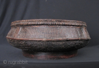 Cambodian Basket: Nice old Cambodian lacquered basket. Very few things survived the reign of the Khmer Rouge which makes old baskets quite rare. Circa 70 years old, there are some old repairs  ...