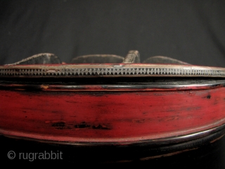 Khmer Betel Box:  
Nice old red and black lacquered Cambodian Siri (betel) box container. This has the original small feet on the bottom, very difficult to find these days. There is  ...