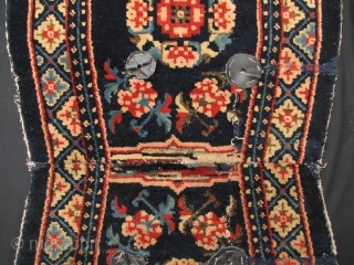 Baotou 

Nice old Batou saddle carpet, with floral medallions and scroll pattern. There are some repairs and restorations which I have highlighted in enlargement two. Early 20th century, the colors are still  ...