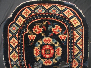 Baotou 

Nice old Batou saddle carpet, with floral medallions and scroll pattern. There are some repairs and restorations which I have highlighted in enlargement two. Early 20th century, the colors are still  ...