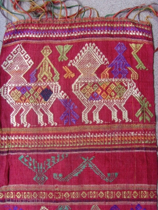 Tai Lue weaving, cotton supplementary weft with silk embroideries.


Tai Lue.


Minority group Laos and Thailand.


Seconed Quarter 20th Century.


0.87 X 0.24 CM
             