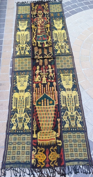 A beautiful example of Sumba Hinggi with 2 techniques, Ikat and traditional.   Mystical figures 4 bold human figures with mysterious designs on their chests and body, two on each woven  ...