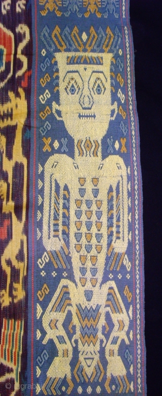 A beautiful example of Sumba Hinggi with 2 techniques, Ikat and traditional.   Mystical figures 4 bold human figures with mysterious designs on their chests and body, two on each woven  ...