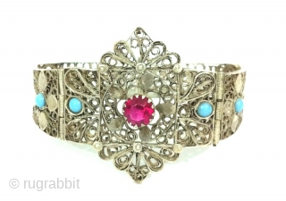 Impressive Persian/Indian Openwork Silver Bracelet, India or Iran, With Beautiful Cut Pink Garnet and Pair Of Turquoise on Both Sides of the Bracelet , Unique Openwork Cut Designs on Silver .
  
