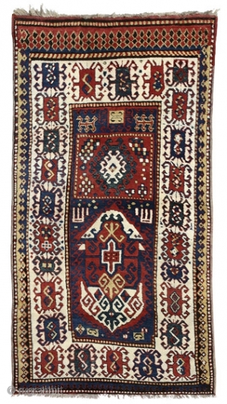 Borchalo Kazak prayer rug
Southwest Caucasus
circa 1870
220 x 117 cm (7’3” x 3’10”) 
Alg 1528
symmetrically knotted wool pile on a wool foundation
A rare and unusual rug characterised by a two panel design: the  ...