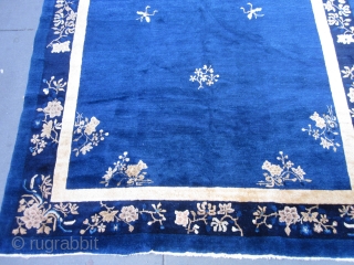 An antique Peking carpet in a very rare gallery format,with a mostly open luminous royal blue ground.The wool is glossy with a desirable patina.There is slight carving to further emphasize the design  ...