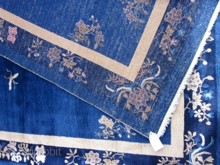 An antique Peking carpet in a very rare gallery format,with a mostly open luminous royal blue ground.The wool is glossy with a desirable patina.There is slight carving to further emphasize the design  ...