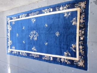 An antique Peking carpet in a very rare gallery format,with a mostly open luminous royal blue ground.The wool is glossy with a desirable patina.There is slight carving to further emphasize the design  ...