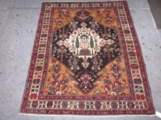 Antique Bakhtiari rug,Chahar Mahal district,West Central Persia circa 1920's,measuring 6.7 x 5.2.This is a village piece made on cotton foundation with single weft technique.The rug has a midnight blue / black hexagonal  ...