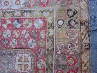 Antique Turkish Oushak circa 1900,measuring 6x4.This Oushak scatter rug has borrowed from many design sources.The border of triple flower modules is purely Turkish and it appears on Ghiordes Prayer rugs of the  ...