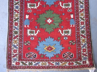 Perpedil Shirvan Rug circa 1920 , 3.1 x 2
 This rare miniature rug exudes cuteness.The two figures holding flowers,the six ivory birds characteristic of larger Perpedil rugs,the alternating light blue and kelly  ...