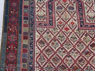 Antique Caucasian Daghestan Prayer Rug , Last Quarter 19th Century 5.10 x 4.3
The ivory ground with a sawtooth lozenge lattice enclosing various colourful flowers in an allover "V' effect is classic Shirvan  ...