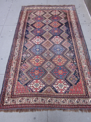NW Persian Carpet 10.3 x 5.10 circa 1900 .

This attractive kalay size piece mixes several design traditions.The main hexagonal medallions in red,orange red,light blue,straw,ivory and green are derived from Caucasian & NW  ...