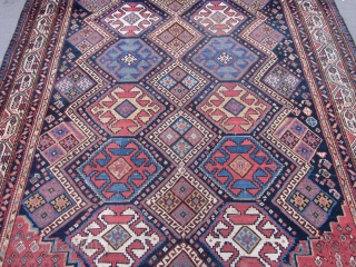 NW Persian Carpet 10.3 x 5.10 circa 1900 .

This attractive kalay size piece mixes several design traditions.The main hexagonal medallions in red,orange red,light blue,straw,ivory and green are derived from Caucasian & NW  ...