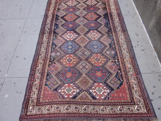 NW Persian Carpet 10.3 x 5.10 circa 1900 .

This attractive kalay size piece mixes several design traditions.The main hexagonal medallions in red,orange red,light blue,straw,ivory and green are derived from Caucasian & NW  ...