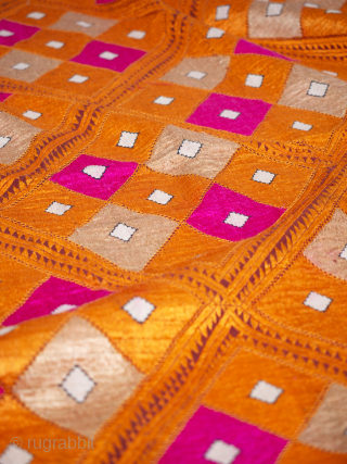 Orange and Pink Phulkari Bagh Early 20th Century

Punjab, early 20th Century circa 1920s/30's. 228cm x 132.5cm cm (89 x 52 inches). Densely embroidered with six and a half rows of large lozenges, latticed in the most  ...