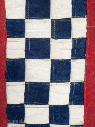 Rare, Royal, Red Check Kuba Cloth

The central panel comprises alternate squares of coarse plain raffia and finely woven red dyed raffia, the plain panels embellished with cowrie shells. Bordered to one edge  ...