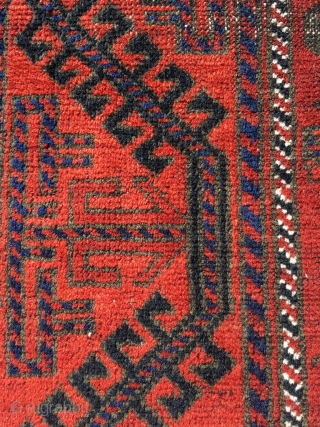 19th century Baluch, unusual Mina Khani design, wide ferocious border. Soft wool and good colors. Corrosion of black dye. Size 48.8 x 40.2 (124 x 102 cm).      