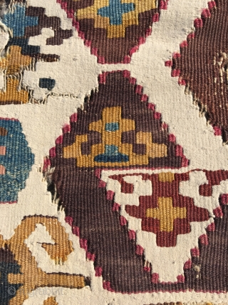 Early Anatolian hooked kilim, one wing. Clean, very good colors (purple, apricot, nice greens), good condition for it's age. Interesting use of dark hooks as partitioning elements, creating a rhythm throughout the  ...