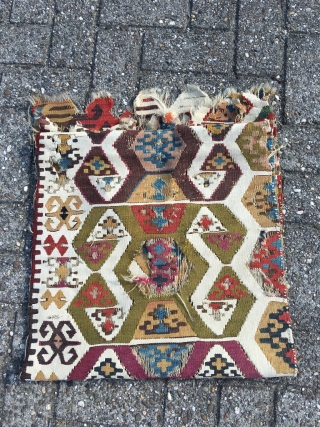 Early Anatolian hooked kilim, one wing. Clean, very good colors (purple, apricot, nice greens), good condition for it's age. Interesting use of dark hooks as partitioning elements, creating a rhythm throughout the  ...