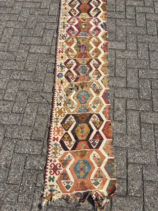 Early Anatolian hooked kilim, one wing. Clean, very good colors (purple, apricot, nice greens), good condition for it's age. Interesting use of dark hooks as partitioning elements, creating a rhythm throughout the  ...