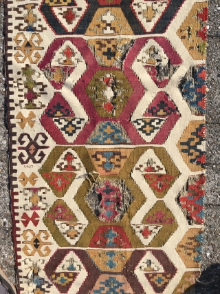 Early Anatolian hooked kilim, one wing. Clean, very good colors (purple, apricot, nice greens), good condition for it's age. Interesting use of dark hooks as partitioning elements, creating a rhythm throughout the  ...