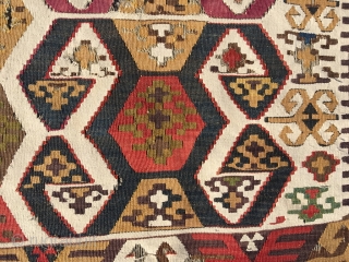 Early Anatolian hooked kilim, one wing. Clean, very good colors (purple, apricot, nice greens), good condition for it's age. Interesting use of dark hooks as partitioning elements, creating a rhythm throughout the  ...