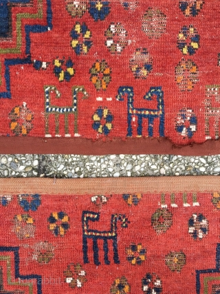 Anatolian fragment with headless human figure and seven camels. 19th century, Konya? Deeply saturated colors, soft wool. Cut but not shut. Bare edges protected by cotton band. Good condition given the age.  ...