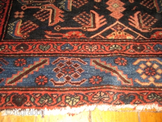 Antique Heriz 100% wool carpet, pre 1900.Beautiful natural colours:deep red,coral,indigo blue,cerulean blue against an inky midnight ground. Medallion centre. There are a few condition issues.Loss of fringe and a slight amount of  ...
