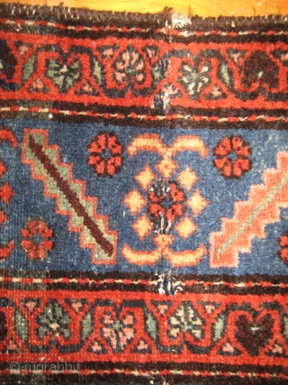 Antique Heriz 100% wool carpet, pre 1900.Beautiful natural colours:deep red,coral,indigo blue,cerulean blue against an inky midnight ground. Medallion centre. There are a few condition issues.Loss of fringe and a slight amount of  ...