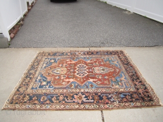 antique serapi heriz rug measuring 4' 11" x 6' 2" condition as shown one hole area of wear and scattered moth issue generally a good pile has been cleaned ends need work  ...